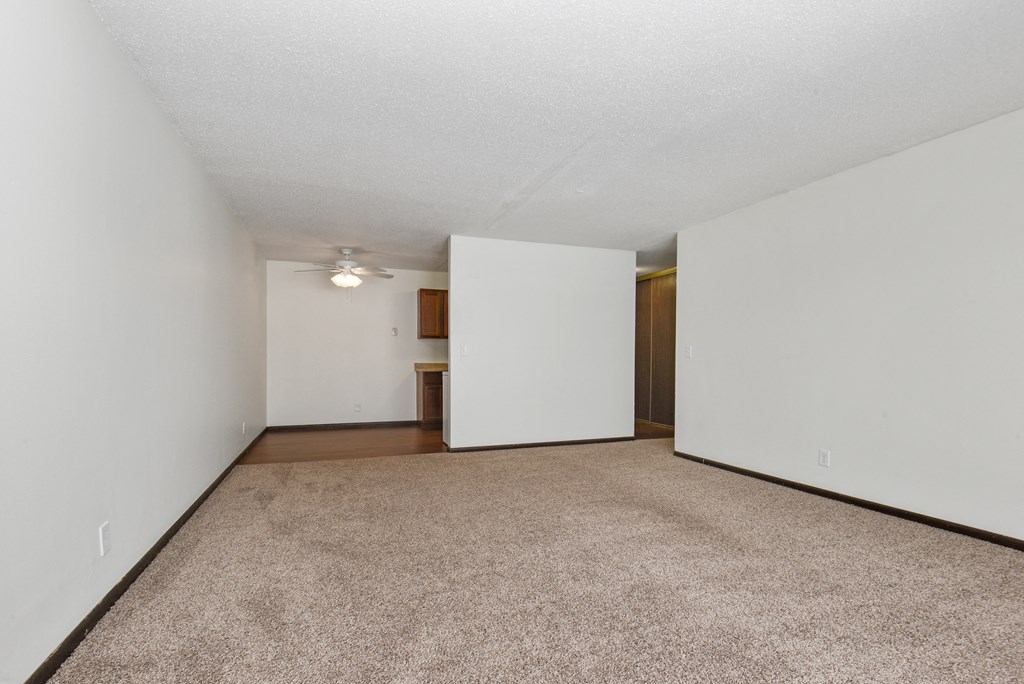 New Brighton, MN Sage Park Apartments a bedroom with a carpeted floor and white walls