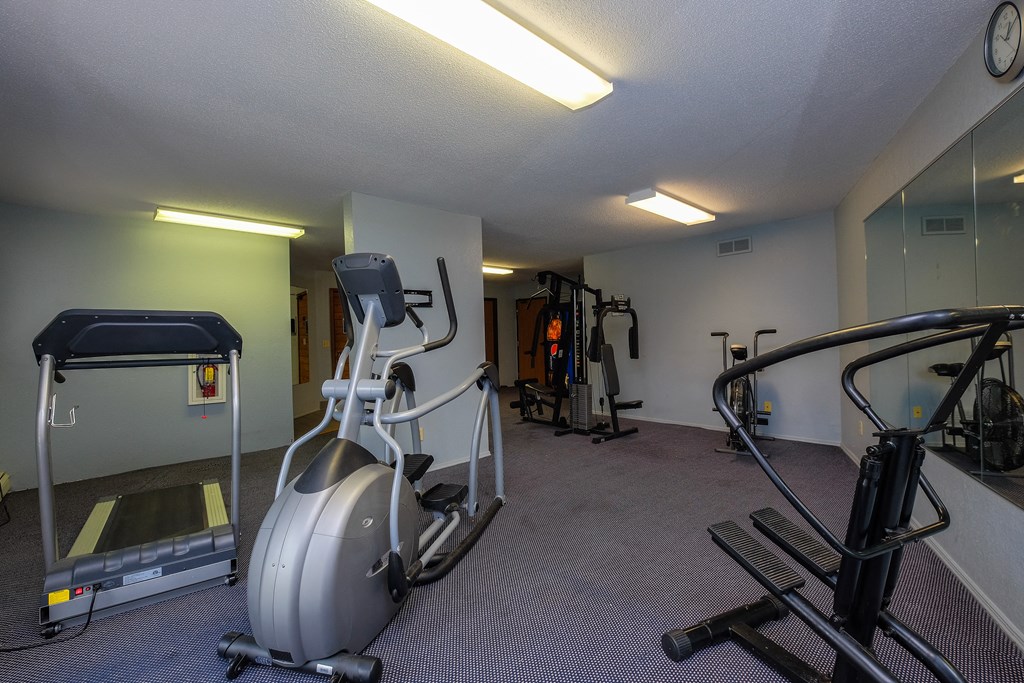 Fargo, ND South Pointe Apartments | Fitness Center a gym with treadmills and other exercise equipment. Fargo, ND South Pointe Apartments