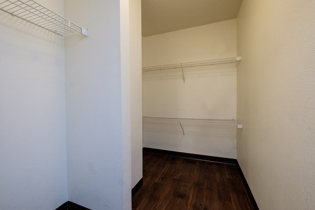 a closet with shelves. Fargo, ND South Pointe Apartments