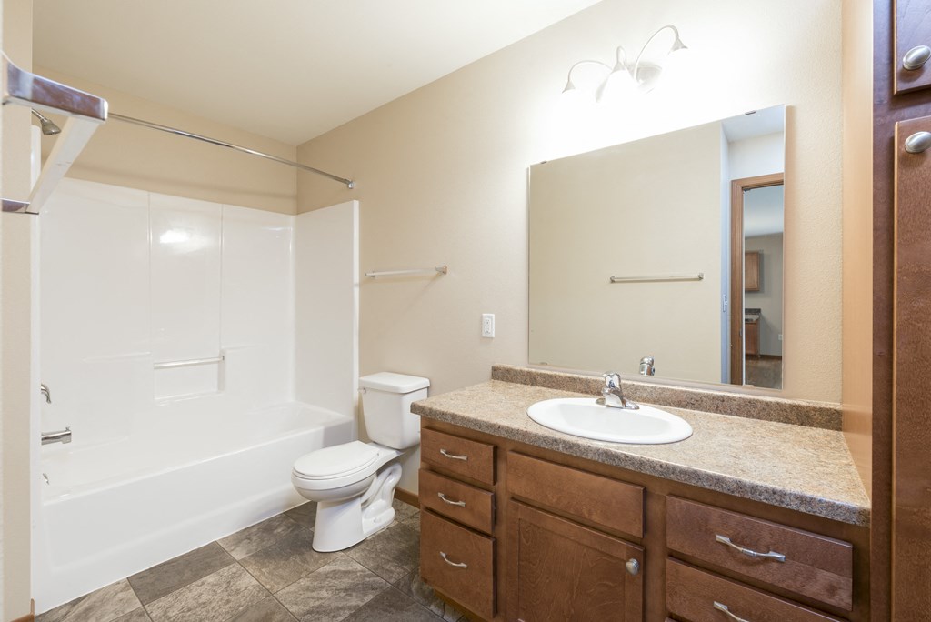 Bathroom with Large Mirror at Stonefield Apartments in Bismarck, ND