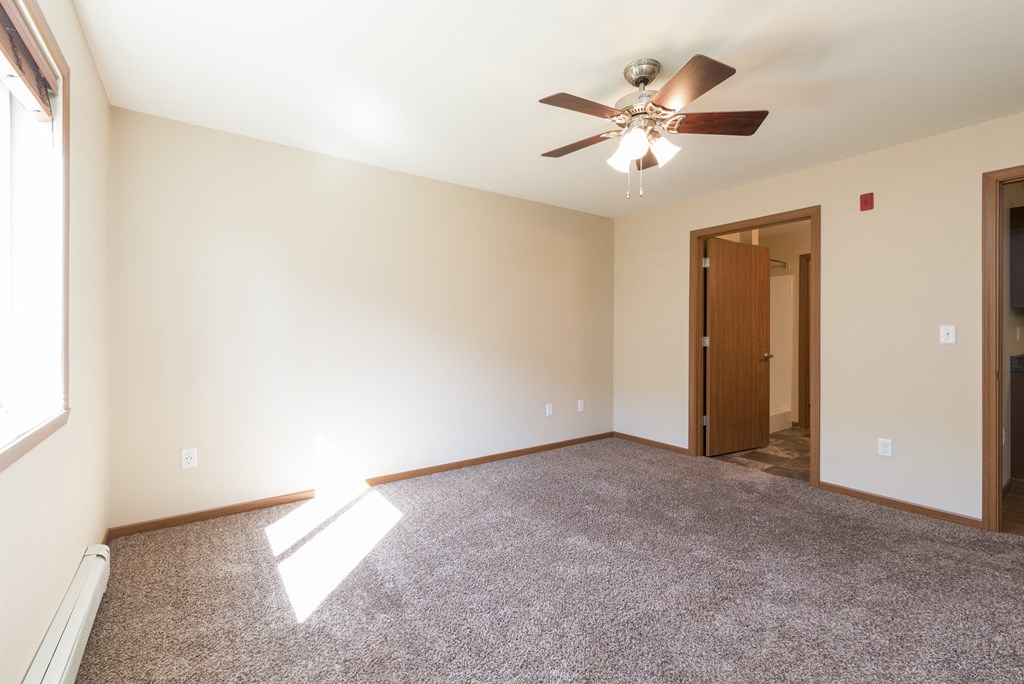 Bedroom with Ceiling Fans at Stonefield Apartments in Bismarck, ND