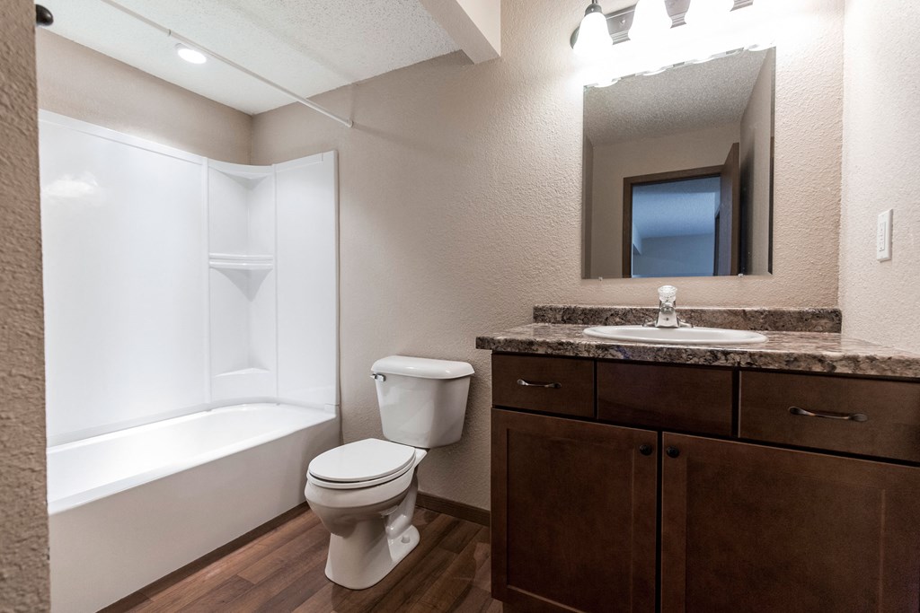 Grand Forks, ND Sunview apartments. a bathroom with a toilet sink and bathtub