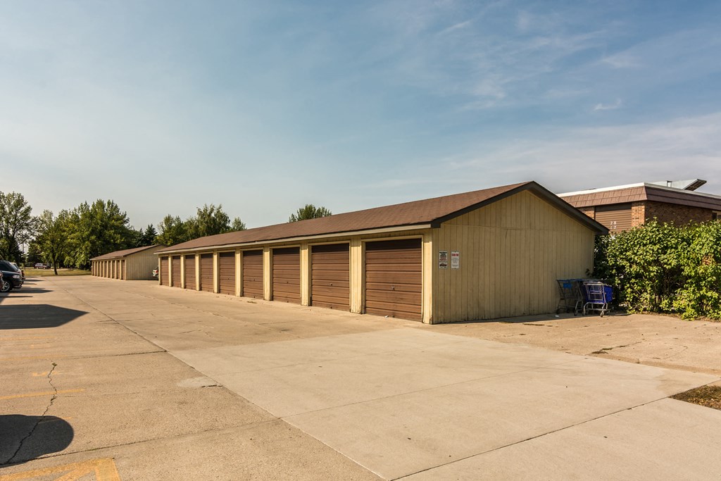 Grand Forks, ND Sunview apartments. a row of garages in front of a building