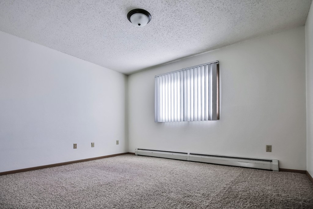 Grand Forks, ND Sunview apartments. a large empty room with a large window