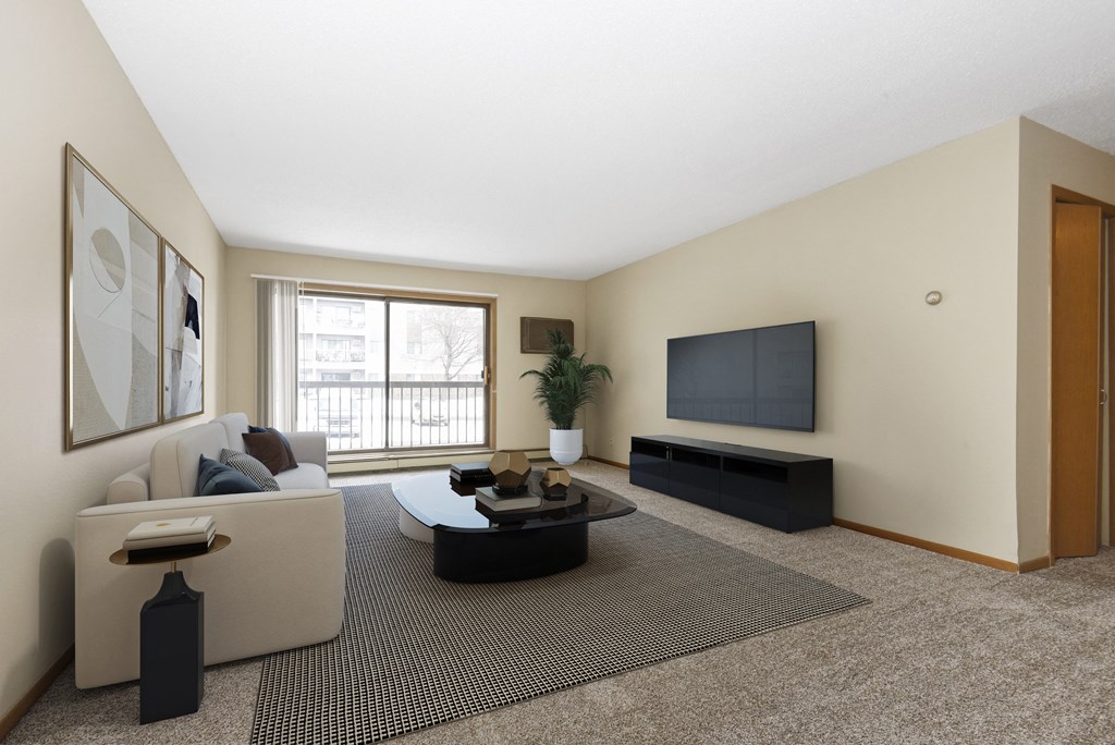 a living room with a couch and a coffee table. Anoka, MN Dellwood Estates