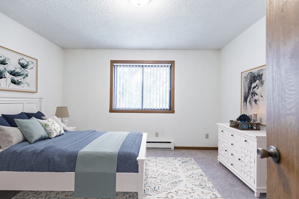 Bismarck, ND Arbor 400 Apartments | Bedroom Bismarck, ND Arbor apartments. a bedroom with a bed and a dresser