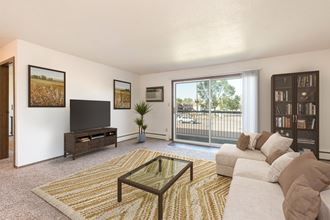 Bismarck, ND Brentwood II Apartments. A living room with a couch and a coffee table