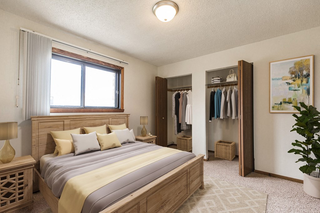 Bismarck, ND Eagle Sky II. A bedroom that features a comfortable bed with neatly arranged bedding and a serene ambiance. Soft lighting creates a relaxing atmosphere, providing a peaceful space for rest and rejuvenation.