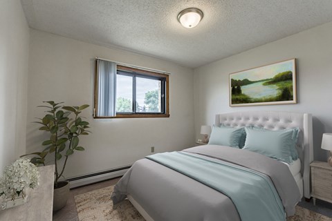 Bismarck, ND Eagle Sky II. A bedroom that features a comfortable bed with neatly arranged bedding and a serene ambiance. Soft lighting creates a relaxing atmosphere, providing a peaceful space for rest and rejuvenation.