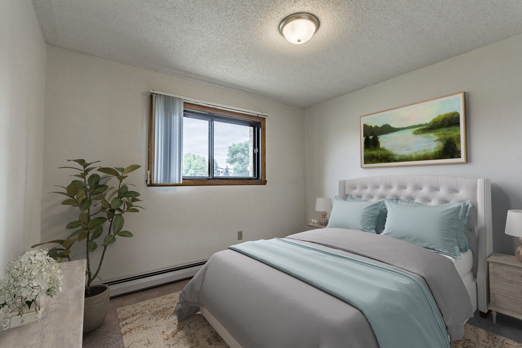 Bismarck, ND Eagle Sky II. A bedroom that features a comfortable bed with neatly arranged bedding and a serene ambiance. Soft lighting creates a relaxing atmosphere, providing a peaceful space for rest and rejuvenation.