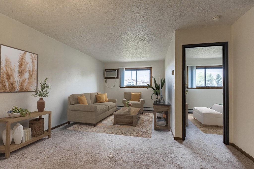 Bismarck, ND Eagle Sky II. a small living room with a couch and a coffee table a small window lets natural light in.