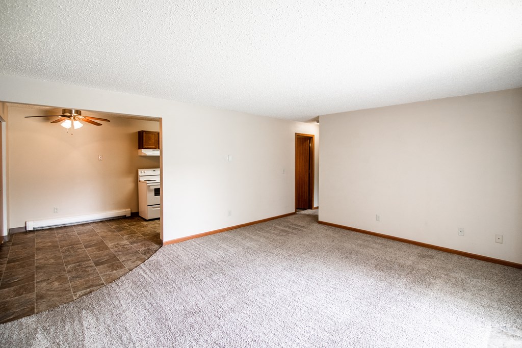 Bismarck, ND Eastbrook Apartments. A living room with the dining room in the background