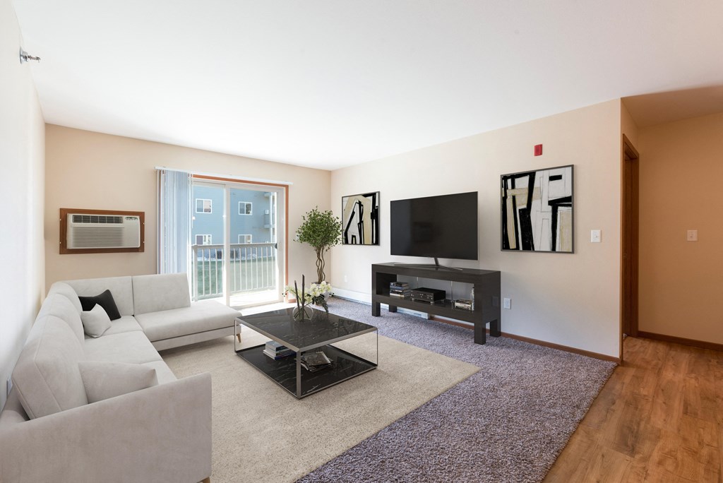Bright Living Room Area Bright Living Room Area at Stonefield Apartments in Bismarck, ND