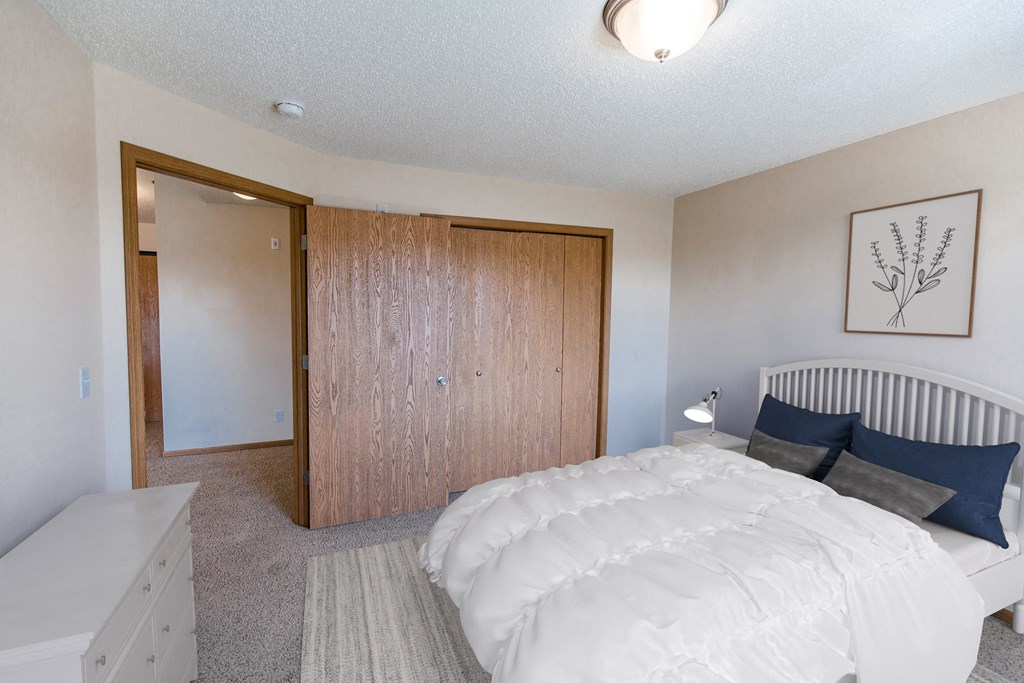 Comfortable Bedroom at Sunset Ridge Apartments in Bismarck, ND
