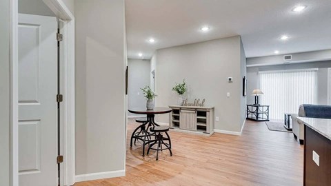 an open living room with a dining room and a kitchen.  Circle Pines, MN Lexington Lofts
