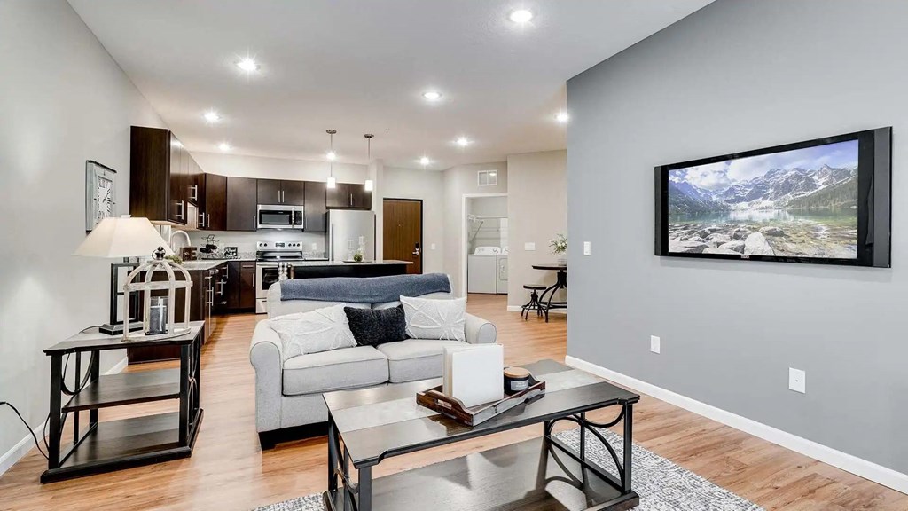 a living room with a couch and a table. Circle Pines, MN Lexington Lofts