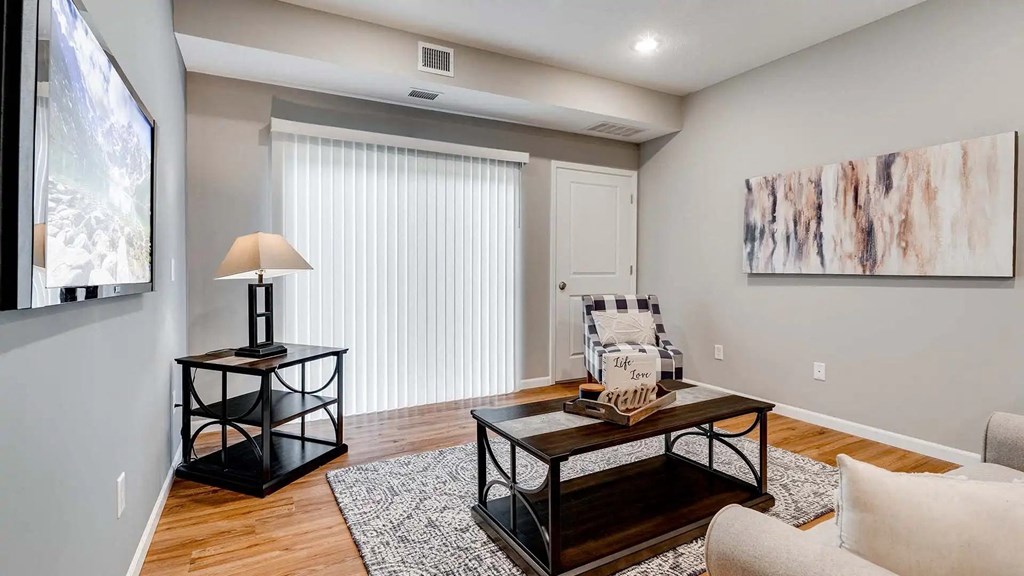 a living room with a couch and a table.  Circle Pines, MN Lexington Lofts