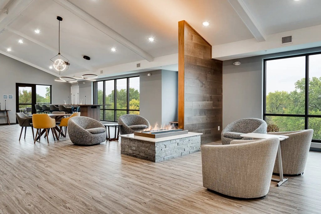a living room with chairs and a fire pit. Circle Pines, MN Lexington Lofts
