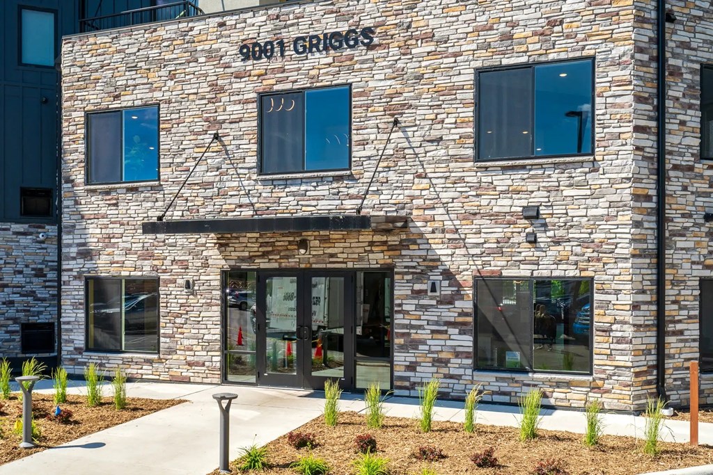 the front of our grocers building with a glass door. Circle Pines, MN Lexington Lofts