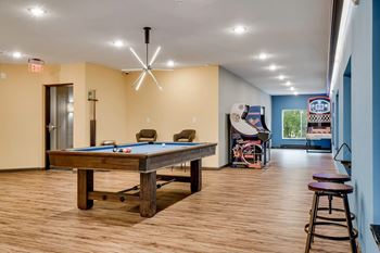 a game room with a pool table. Circle Pines, MN Lexington Lofts