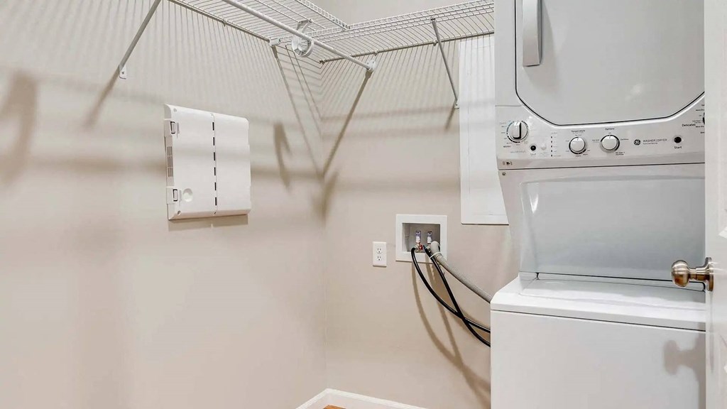 the laundry room has a washer and dryer and a dryer in it. Circle Pines, MN Lexington Lofts