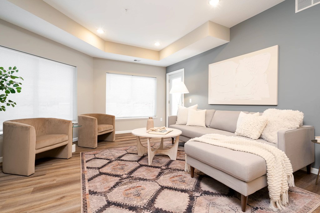 a living room with a couch and chairs. Circle Pines, MN Lexington Lofts