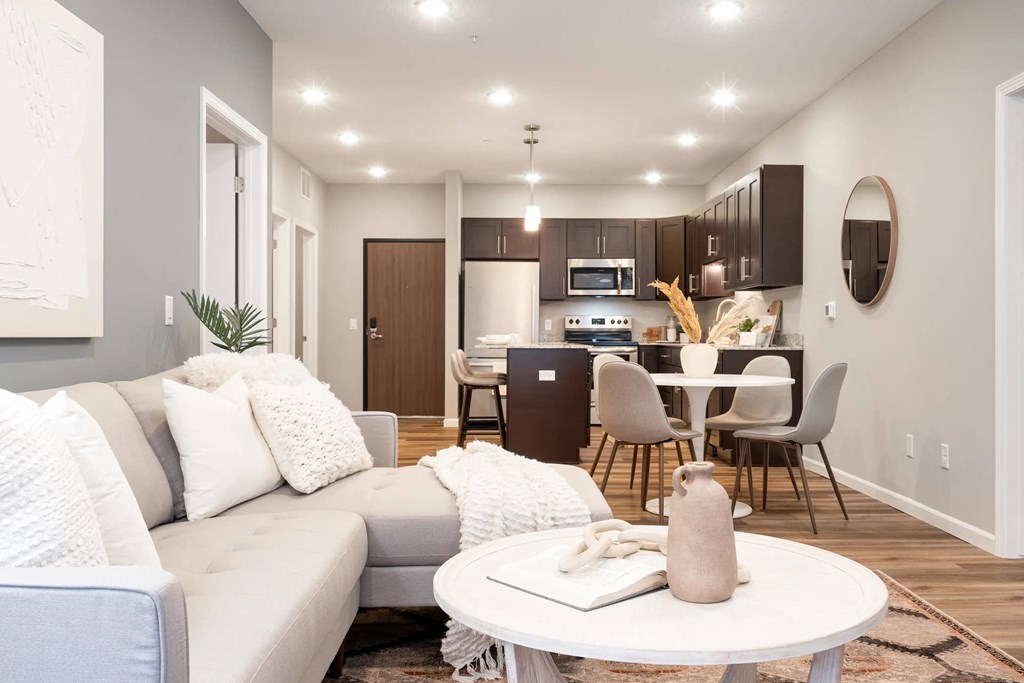 a living room with a couch and a table. Circle Pines, MN Lexington Lofts