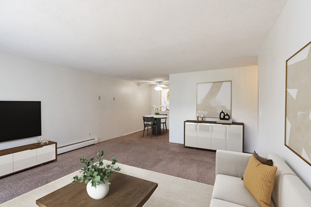 a living room with a couch and a coffee table.Coon Rapids, MN Robinwood Apartments