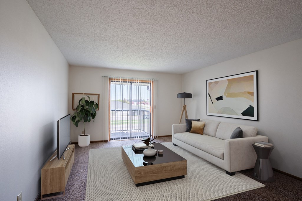 a living room with a white couch and a coffee table. Fargo, ND Bella Vista Apartments