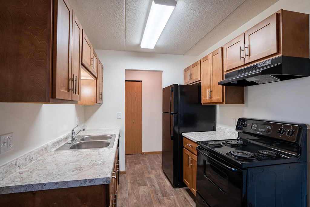 our apartments have a kitchen with a stove and a sink. Fargo, ND Bella Vista Apartments