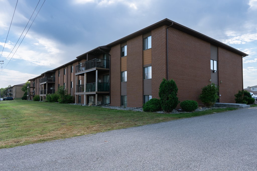 a large brick apartment building on the side of a road. Fargo, ND Bella Vista Apartments