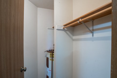 a closet with a floating shelf. Fargo, ND Briar Pointe Apartments