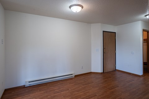 a dining room with wood flooring and white walls. Fargo, ND Briar Pointe Apartments