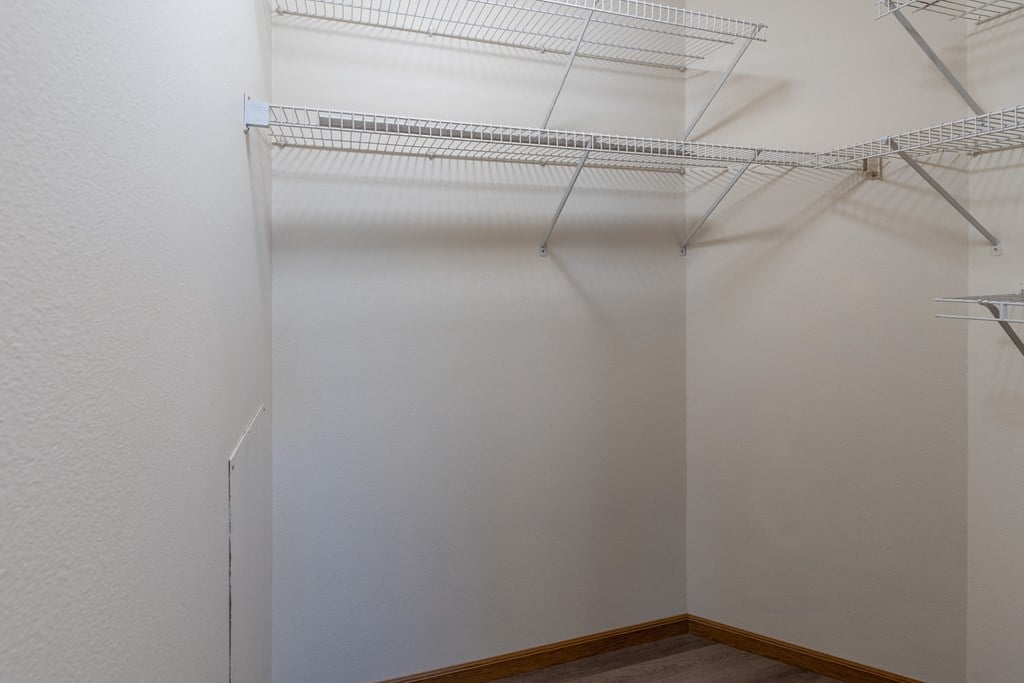 Fargo, ND Cambridge Apartments. A large closet with shelves.