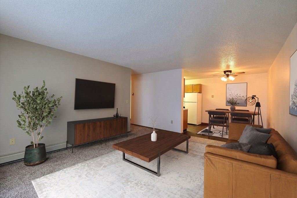 a living room with a couch and a coffee table. Fargo, ND Chestnut Ridge Apartments