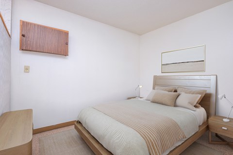 Fargo, ND Cityside Apartments a bedroom with a bed and a nightstand