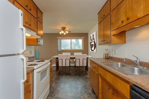 the kitchen and dining area of a rental house. Fargo, ND Country Club Apartments.