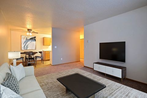 Fargo, ND Dakota Manor Apartments. a living room with a couch and a coffee table