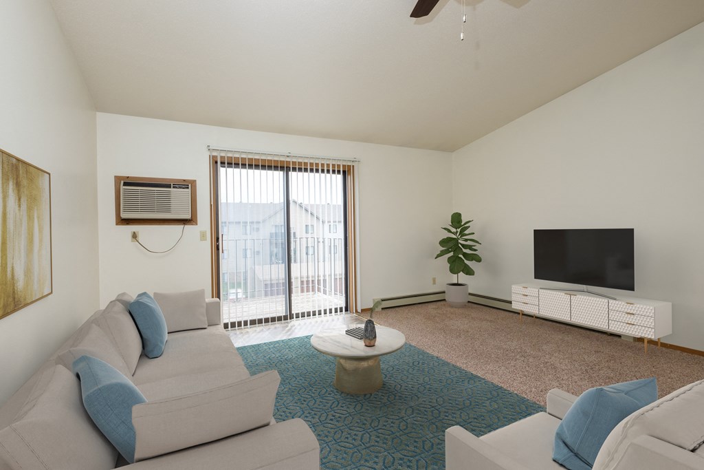 Fargo, ND Flickertail Apartments a living room with couches and a coffee table