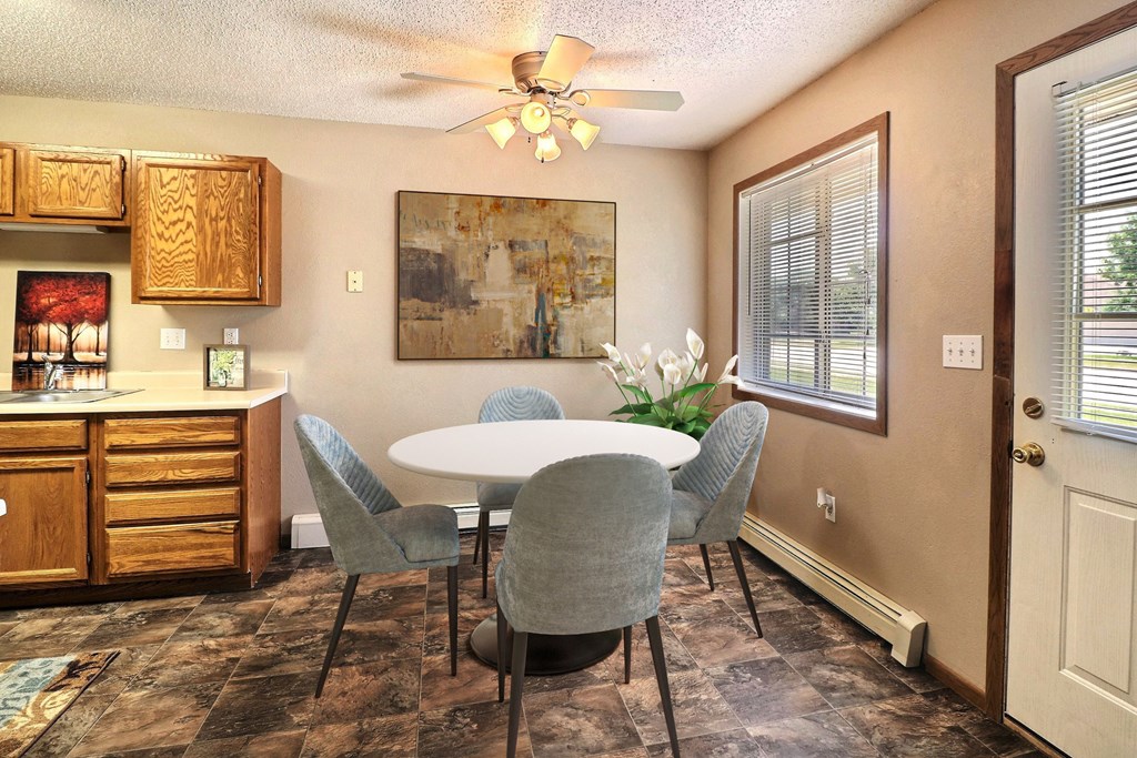 Fargo, ND Foxboro Townhomes. a dining room with a table and chairs
