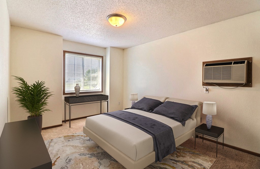 Fargo, ND Foxboro Townhomes. a bedroom with a bed and a window