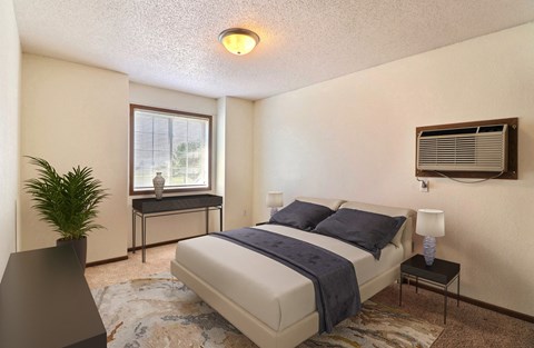 Fargo, ND Foxboro Townhomes. a bedroom with a bed and a window