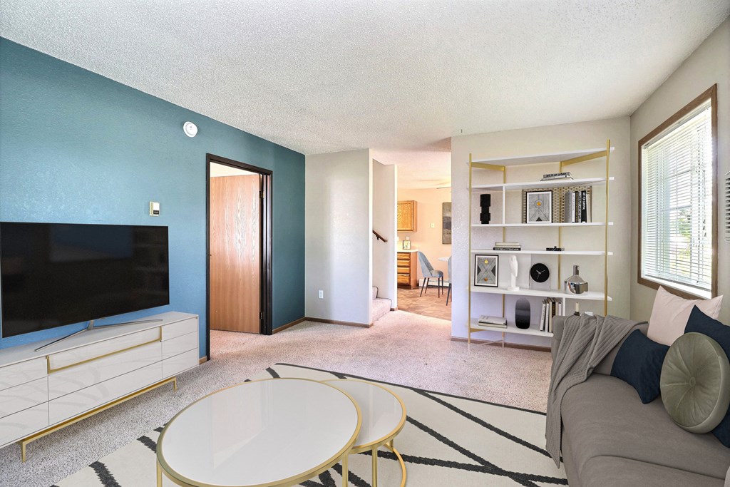 Fargo, ND Foxboro Townhomes. a living room with a couch table and television