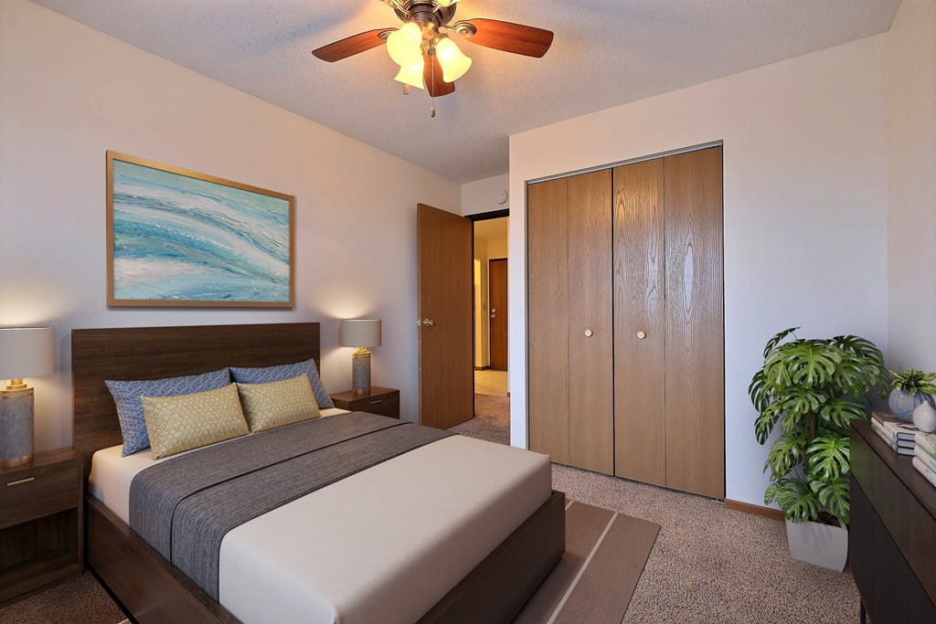 a bedroom with a bed and a ceiling fan at France, Fargo North Dakota
