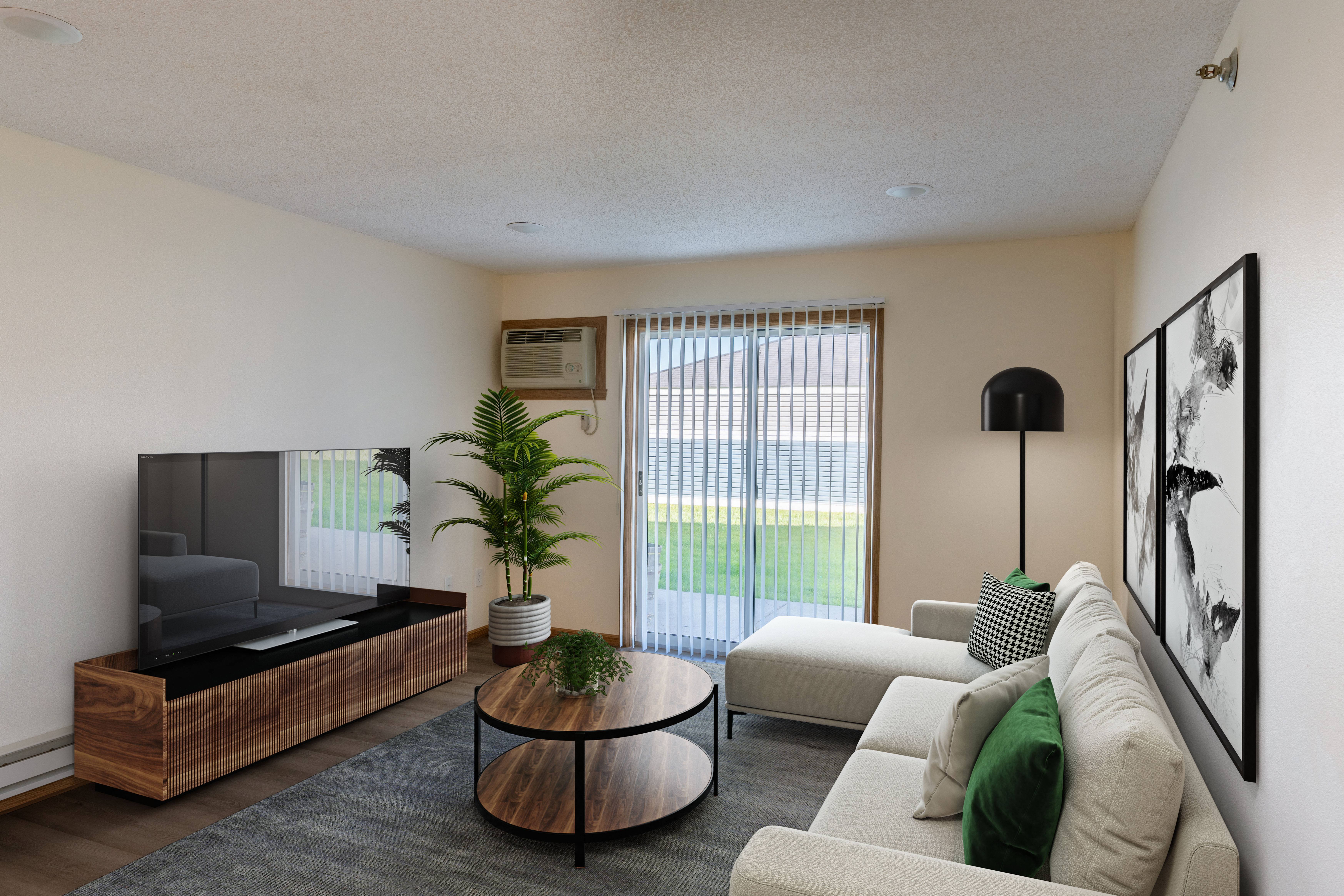 Fargo, ND Lake Crest Apartments. A living room with beige walls and a sliding glass door