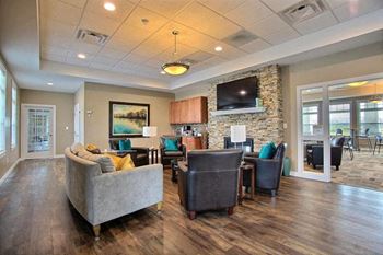 Fargo, ND Lake Crest Apartments.  living room filled with furniture and a flat screen tv