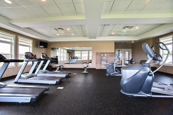 Fargo, ND Lake Crest Apartments. A gym with treadmills and other exercise equipment