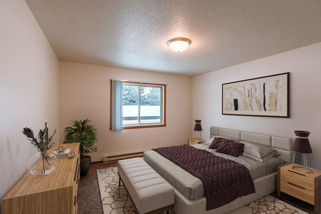 a bedroom with a bed and a window. Fargo, ND Long Island Apartments