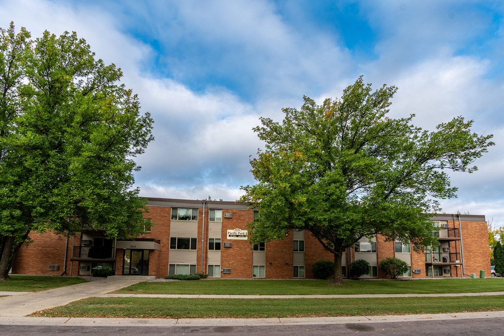 Fargo, ND Pacific Park Apartments. An apartment building with trees in front of it