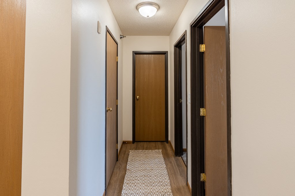 Fargo, ND Parkside Apartments. A corridor with two doors and a carpeted floor